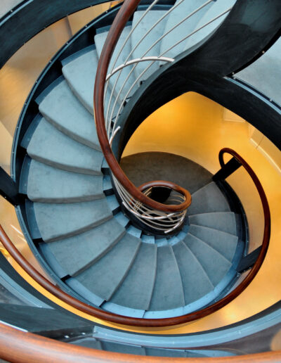 modern helical staircase centre with orange and black design