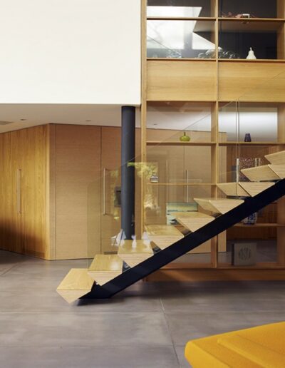 floating wooden staircase with glass banister