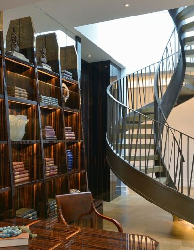 residential library with modern spiral staircase
