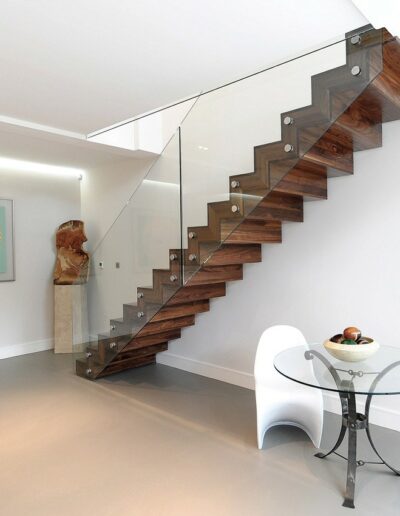 Floating wood staircase with glass side